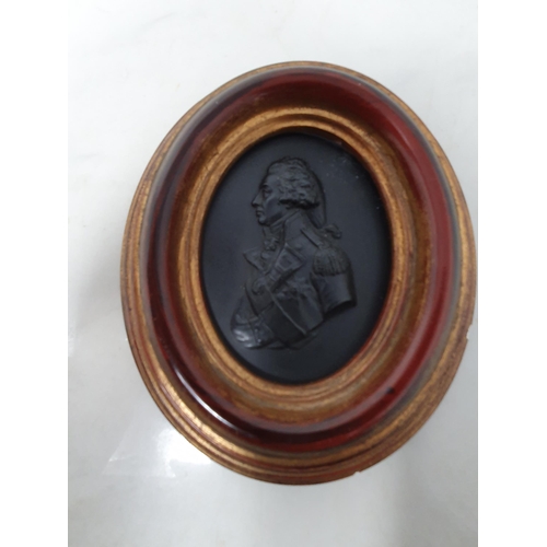 53 - A black basalt oval Bust Portrait of Nelson, 3 1/2 x 2 1/2in, in later gilt frame (Cab)