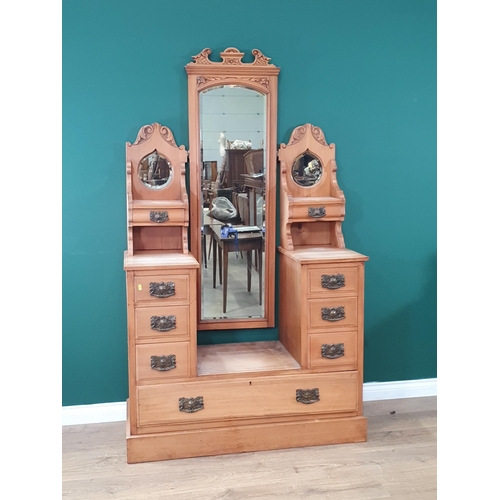 554 - A satinwood Dressing Chest with adjustable mirror, flanked by pair of teardrop mirrors above four fi... 