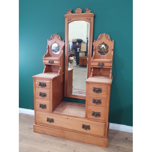 554 - A satinwood Dressing Chest with adjustable mirror, flanked by pair of teardrop mirrors above four fi... 