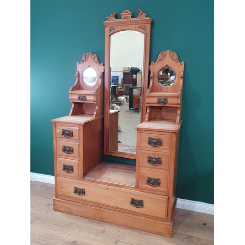 554 - A satinwood Dressing Chest with adjustable mirror, flanked by pair of teardrop mirrors above four fi... 