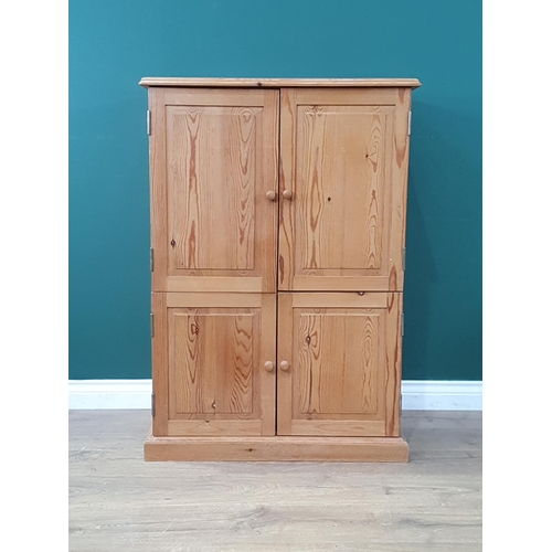 556 - A modern pine four door Television Cupboard A/F, 3ft 6