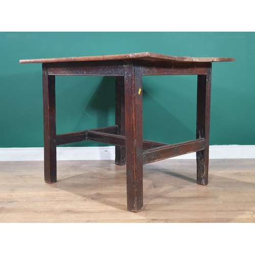 592 - An antique oak Table, the four plank top on square supports and H stretcher, 2ft 5