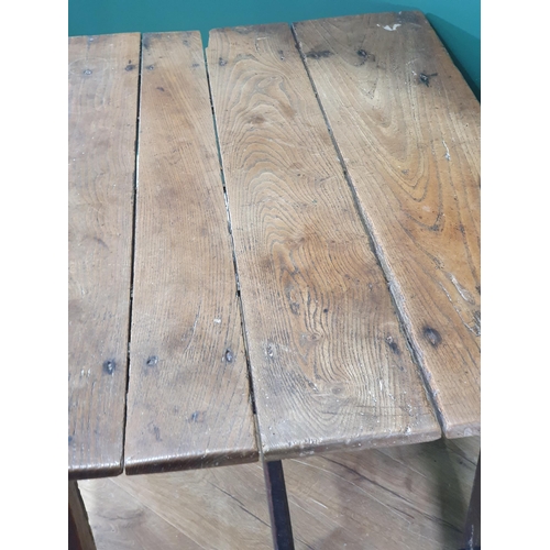 592 - An antique oak Table, the four plank top on square supports and H stretcher, 2ft 5