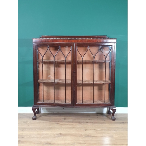 594 - A mahogany glazed Display Cabinet with two fitted shelves, raised on claw and supports, 4ft 1