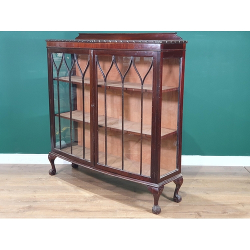 594 - A mahogany glazed Display Cabinet with two fitted shelves, raised on claw and supports, 4ft 1