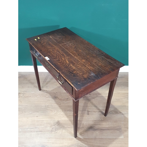 595 - An oak Side Table with single fitted drawer, raised on square tapered supports, 2ft 5