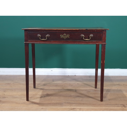 595 - An oak Side Table with single fitted drawer, raised on square tapered supports, 2ft 5