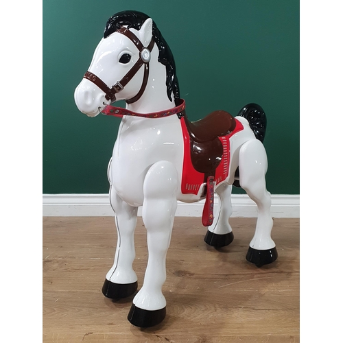 693 - A painted metal Childs sit on Horse. 2ft 7