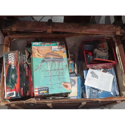 694 - A Vintage Travel Trunk, with Remote Control Vehicles, other games etc. (R7).