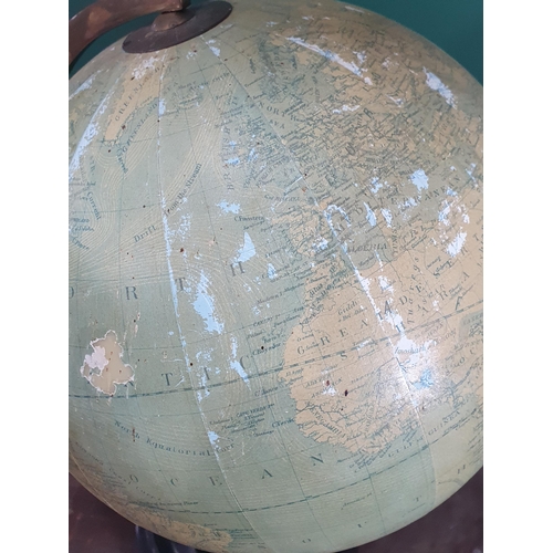 697 - A reproduction Globe on ebonised stand, bearing the name 