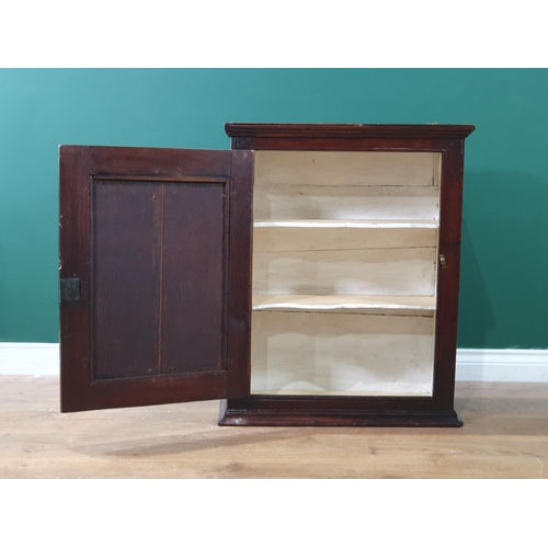 7 - An 18th Century oak Food Cupboard with single panel door, enclosing two shaped fitted shelves, 2ft 7... 