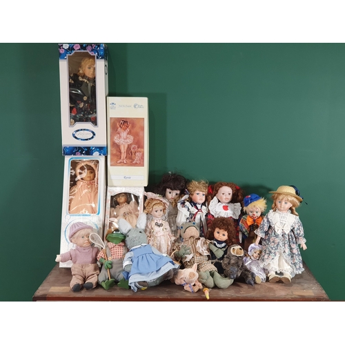 701 - A box of assorted Dolls including, a boxed Tuscany Porcelain Doll, a Leonardo Collection Boxed Doll,... 