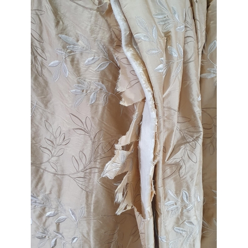 717 - A pair of beige Curtains with raised white and gold leafage design, approx 8ft 8in drop,  4ft 1in wi... 