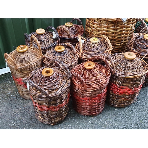 81 - A quantity of cane covered stoneware Jards, including a large one named J Pickup & Co. Blackburn