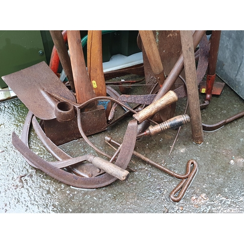 83 - A quantity of Garden Tools, two Watering Cans, a galvanised 