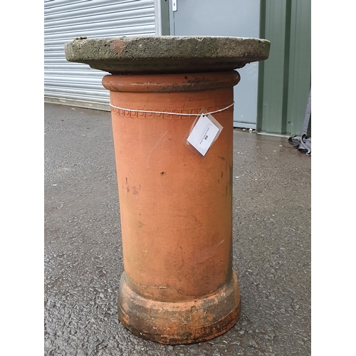 86 - A reconstituted Bird Bath resting on a terracotta Chimney Pot, and a rectangular galvanised Water Ta... 