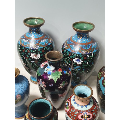 238 - A collection of small Cloisonne Vases with floral and butterfly designs, a Jar and Cover, and a twin... 