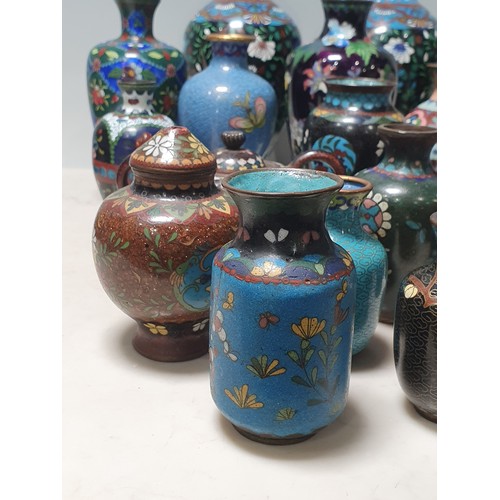 238 - A collection of small Cloisonne Vases with floral and butterfly designs, a Jar and Cover, and a twin... 