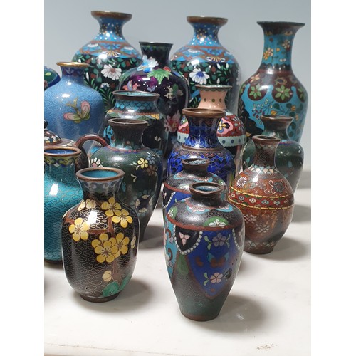 238 - A collection of small Cloisonne Vases with floral and butterfly designs, a Jar and Cover, and a twin... 