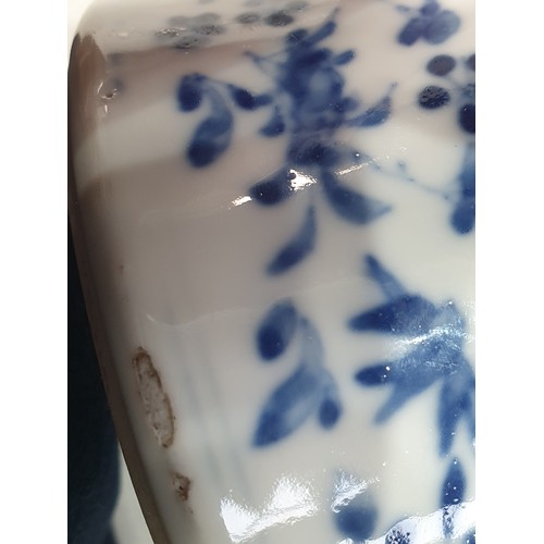 377 - A Chinese blue and white ceramic Vase with figures supporting vases, and all over bird and floral pa... 