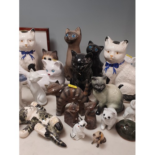 246 - A collection of various models of Cats, two framed cat Prints and an oil Lamp and shade Some A/F