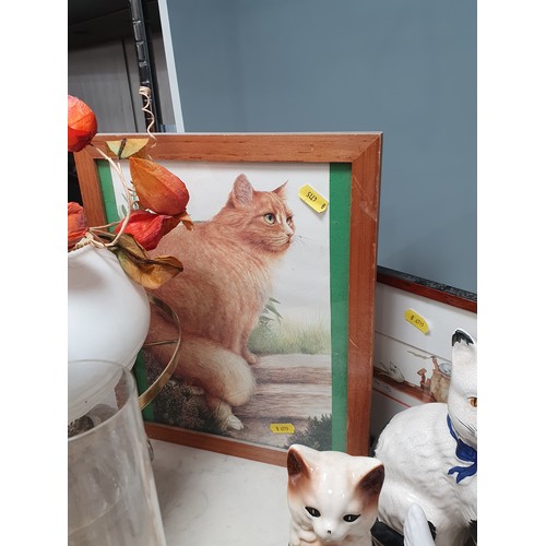 246 - A collection of various models of Cats, two framed cat Prints and an oil Lamp and shade Some A/F