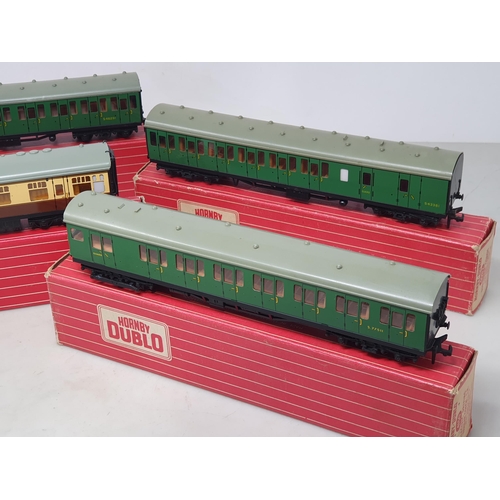 116 - A boxed Hornby Dublo 4150 S.R. Electric Driving Trailer Coach, 4081 S.R. Suburban Coach, 4082 S.R. S... 