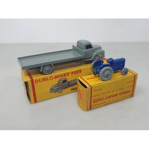 19 - A boxed Dublo Dinky Toys 066 Bedford Flat Truck and 069 Tractor, mint. Both vehicles in mint conditi... 