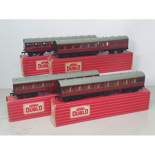 22 - Two boxed Hornby Dublo 4083 BR Suburban Coaches and two boxed 4084 Suburban Coaches, Nr M-M. Coaches... 