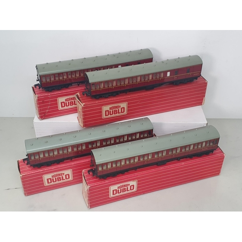 22 - Two boxed Hornby Dublo 4083 BR Suburban Coaches and two boxed 4084 Suburban Coaches, Nr M-M. Coaches... 