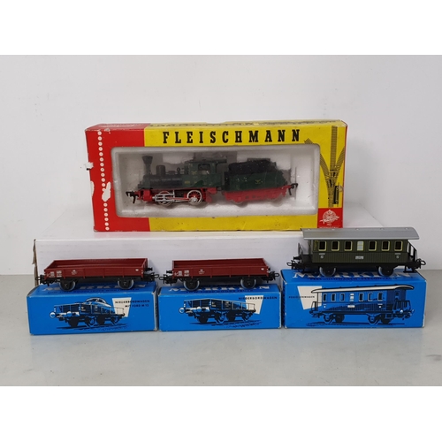 357 - A boxed Fleischmann HO scale 4110 0-4-0 Locomotive and Tender and three boxed Marklin HO scale Wagon... 