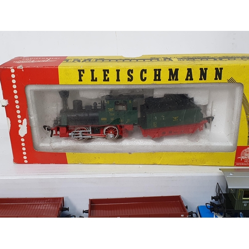 357 - A boxed Fleischmann HO scale 4110 0-4-0 Locomotive and Tender and three boxed Marklin HO scale Wagon... 