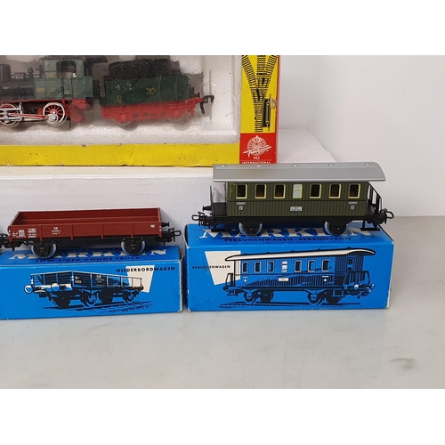 357 - A boxed Fleischmann HO scale 4110 0-4-0 Locomotive and Tender and three boxed Marklin HO scale Wagon... 