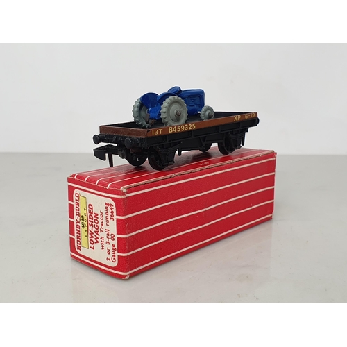 39 - A boxed Hornby Dublo 4849 Export Low-sided Wagon with tractor, unused. Wagon and tractor in mint con... 