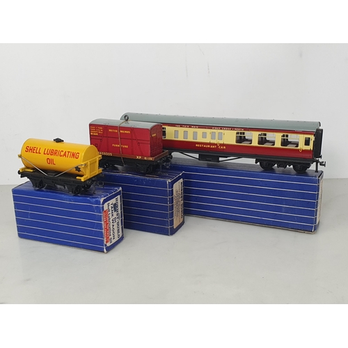 55 - A Hornby Dublo D1 'Shell' Tank Wagon, D1 Low-sided Wagon and D20 Restaurant Car in over sticker 3-ra... 