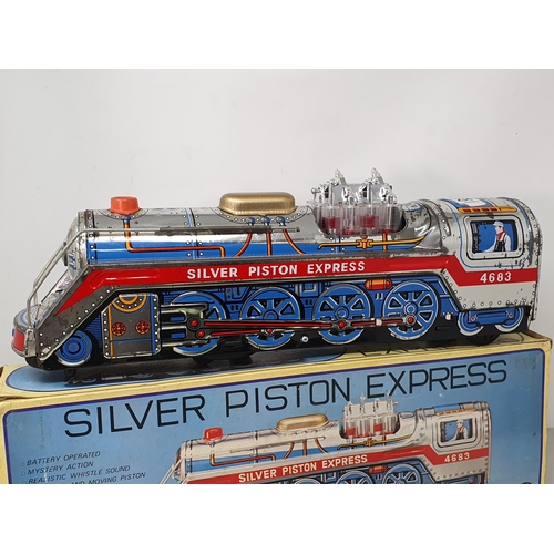 406 - A boxed MT Toys 'Silver Piston Express', two clockwork Frogs, two Postal Telegraph Junior Sets and a... 