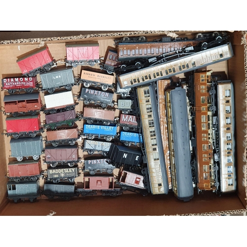 427 - Four boxes of unboxed Hornby, Peco, Bachmann, Lima and other 00 gauge Wagons and LNER teak Coaches (... 