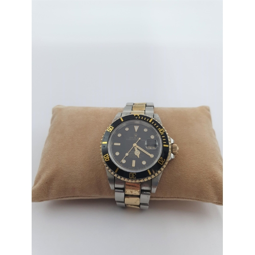 142 - A gentleman's automatic Rolex Oyster Perpetual Date Submariner Wristwatch the black dial with hourly... 