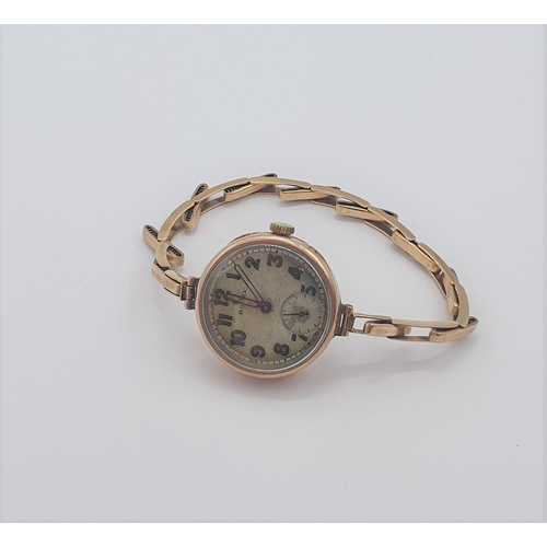 144 - A lady's early Rolex manual wind Wristwatch the circular dial with arabic numerals, minute track and... 