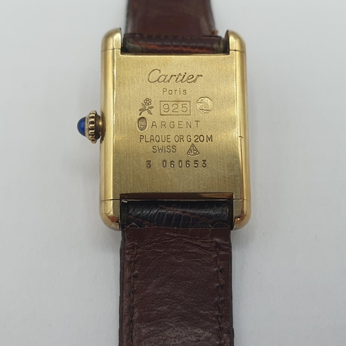 146 - A lady's 1980's Must de Cartier manual wind Wristwatch the rectangular cream dial with black hands a... 