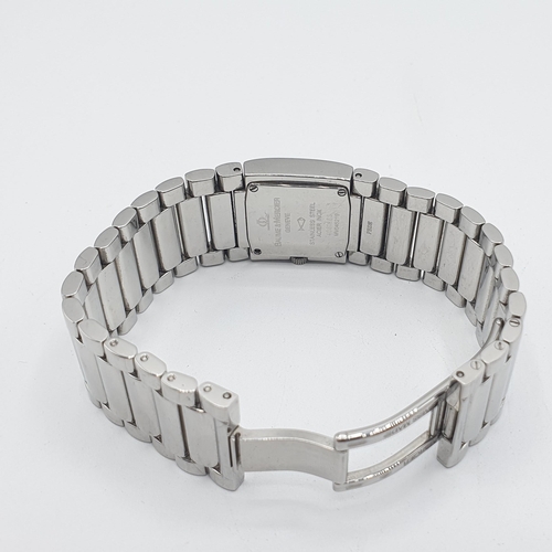 148 - A lady's Baume & Mercier 'Catwalk' quartz Wristwatch the square mirrored dial with matt hands in sta... 