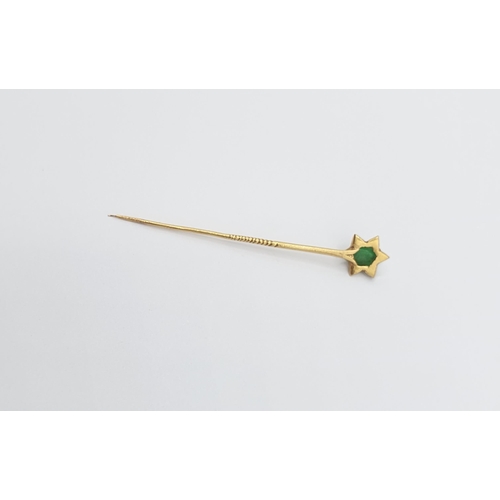 176 - A gold Stick Pin (tests as 22ct) set oval jadeite cabochon in star frame, approx 3.60gms, approx 65m... 