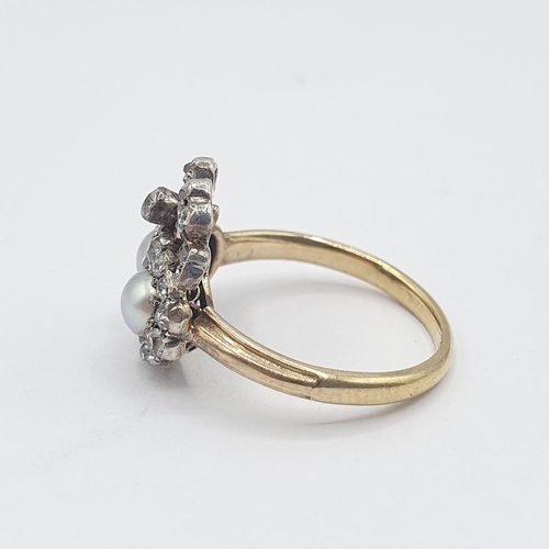 179 - A 19th Century Pearl and Diamond ribbon and heart Cluster Ring close-set two half pearls within fram... 