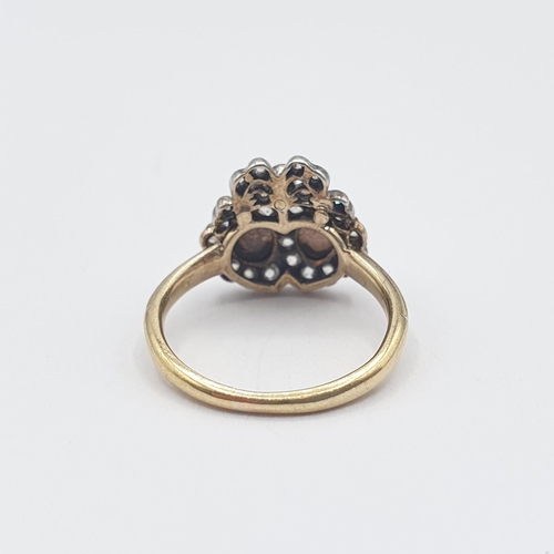 179 - A 19th Century Pearl and Diamond ribbon and heart Cluster Ring close-set two half pearls within fram... 