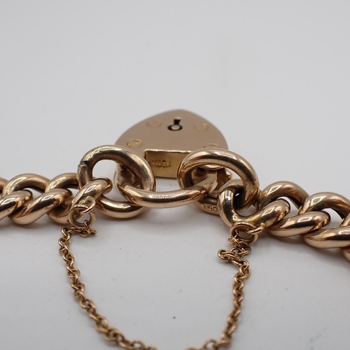 182 - A 15ct gold curb link Bracelet on padlock fastener, approx 16.70gms