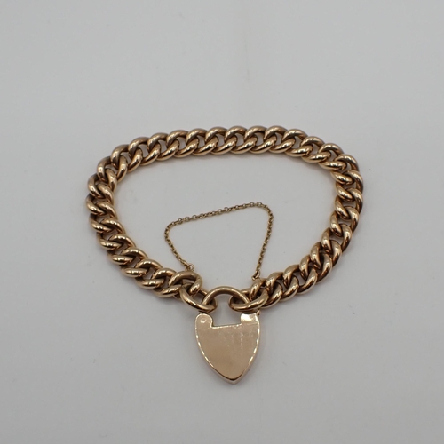 182 - A 15ct gold curb link Bracelet on padlock fastener, approx 16.70gms