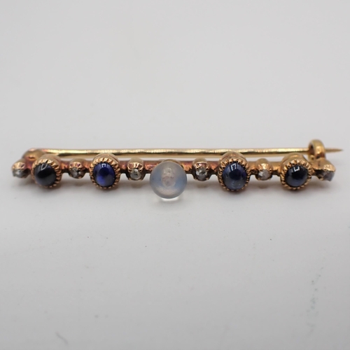 184 - A Moonstone, Diamond and Sapphire Bar brooch having central moonstone, four sapphire cabochons and r... 