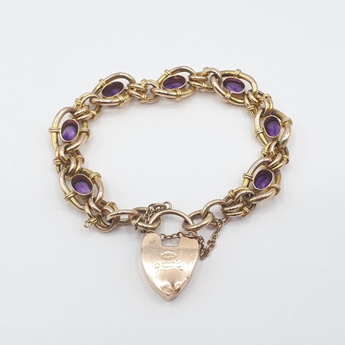 186 - An Amethyst Bracelet rubover-set seven oval-cut stones in fancy link chain on padlock fastener in 9c... 