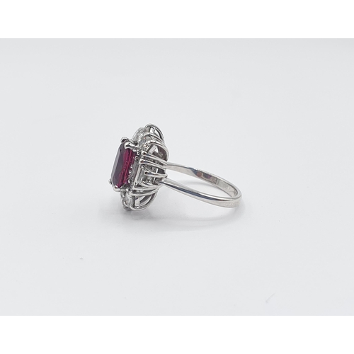 192 - An Art Deco style Ruby and Diamond Cluster Ring corner claw-set rectangular cushion-cut ruby, approx... 