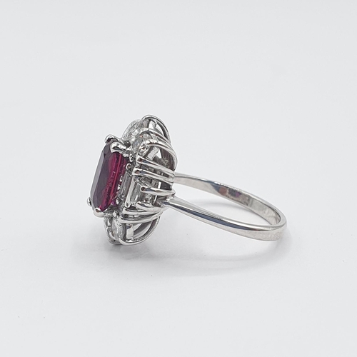 192 - An Art Deco style Ruby and Diamond Cluster Ring corner claw-set rectangular cushion-cut ruby, approx... 